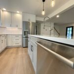 kitchen remodel in raleigh nc. New layout by removing dividing wall between kitchen and living room to create openness and gathering place around new large island